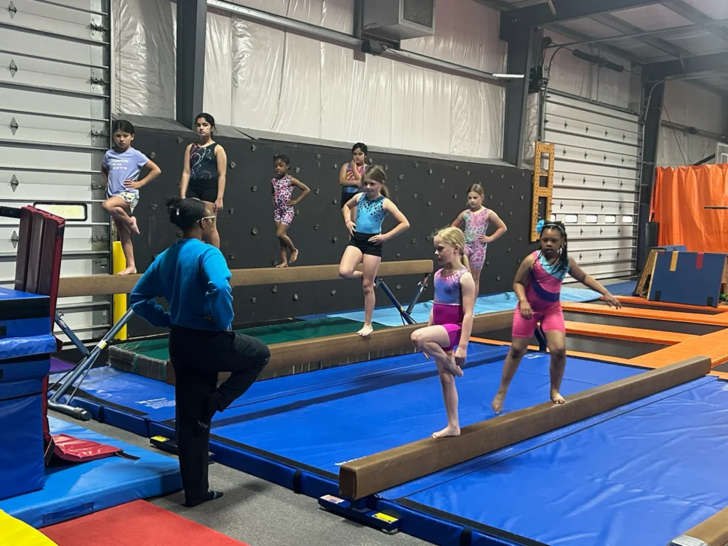 gym champs class on balance beams